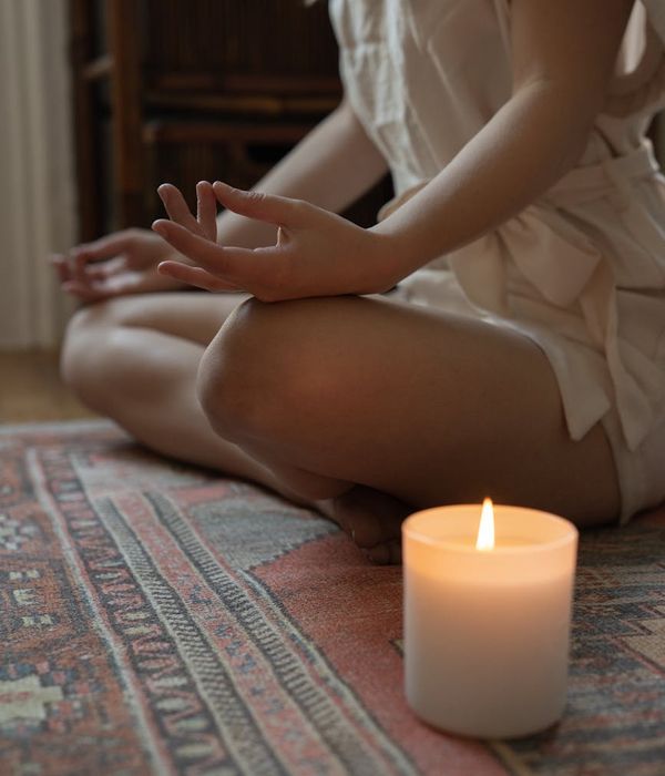 Woman in a calm yoga pose, embodying focus and tranquility.
